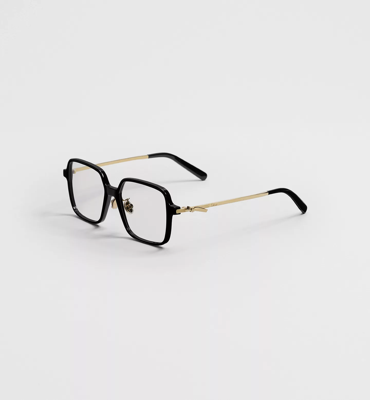 A square acetate frame turned three-quarters, temples open